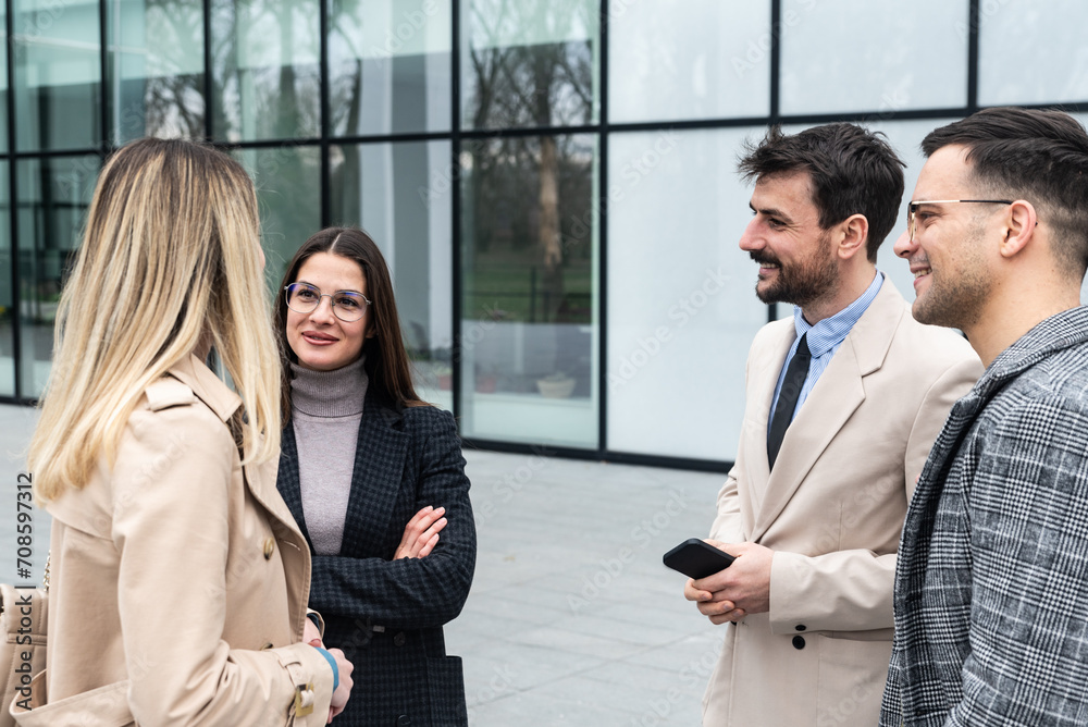 Group of young business people product strategy experts waiting for staff meeting with employer from human resources for job search in front of office building. Businessmen and businesswomen discuss Group of young business people product strategy experts waiting for staff meeting with employer from human resources for job search in front of office building. Businessmen and businesswomen discuss