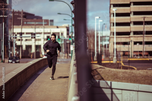 Man jogging in urban environment during daytime