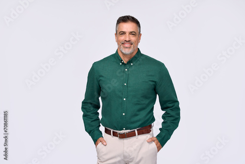 Canvas Print Confident elegant middle aged business man entrepreneur, smiling older professional executive, stylish businessman leader wearing green shirt looking at camera standing isolated on gray, portrait