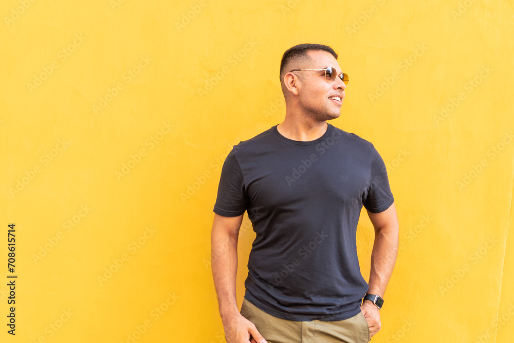Man Gazing in Sunlight Against Yellow Wall Man Gazing in Sunlight Against Yellow Wall