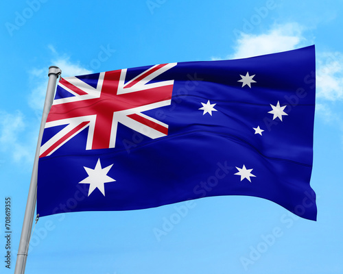 Australia flag fluttering in the wind on sky.