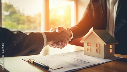 
The real estate agent discussed the home purchase terms and requested the customer to sign the documents to finalize the contract legally. This relates to the sale and insurance of homes photo