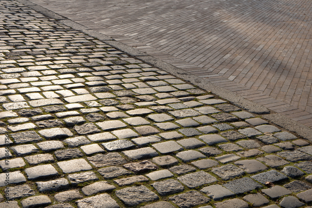 The pavement area is paved with gray large stone texture