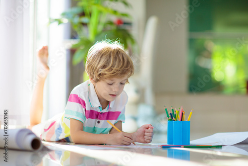 Child drawing. Kid painting rainbow.