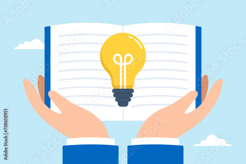 Big hand holds open book to discovering lightbulb idea