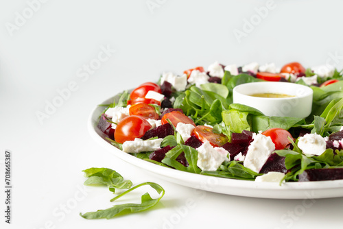 salad of beets, spinach, feta cheese, olive oil, copy space, close-up