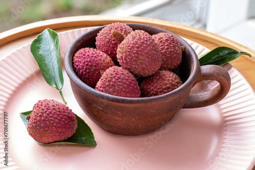 Cup of lychee. Rustic style. Litchi Sonn. Ripe lychees. Tropical fruits. Litchi chinensis