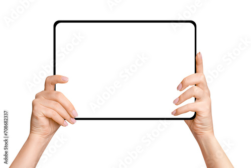 Female hands holding tablet with blank screen on empty background photo