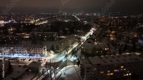 Wallpaper Mural Drone footage of a cityscape during a winter snow night Torontodigital.ca
