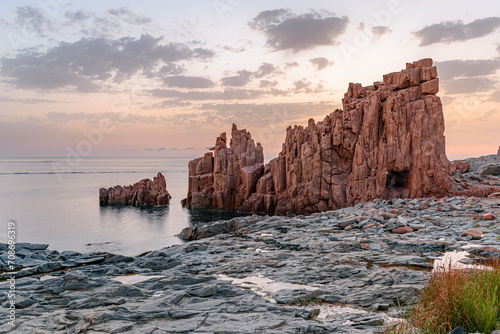 Geological feature called Rocce Rosse (red rocks) in Arbatax at the sunrise; east coast of Sardinia, Italy photo