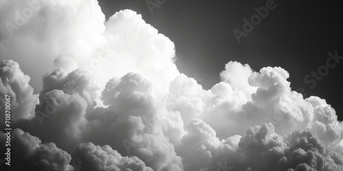 A black and white photo of a plane flying in the sky. Suitable for travel and aviation themes
