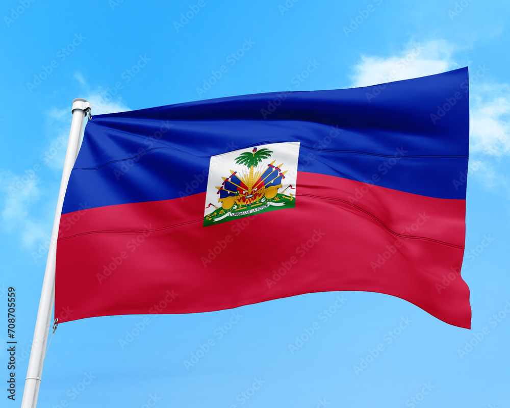 Naklejka premium Haiti flag fluttering in the wind on sky.