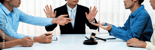 Lawyer acting as mediator broke a compromise between two parties to resolve business dispute through negotiation at law firm office. Legal mediation and conflict resolution service. Panorama Rigid