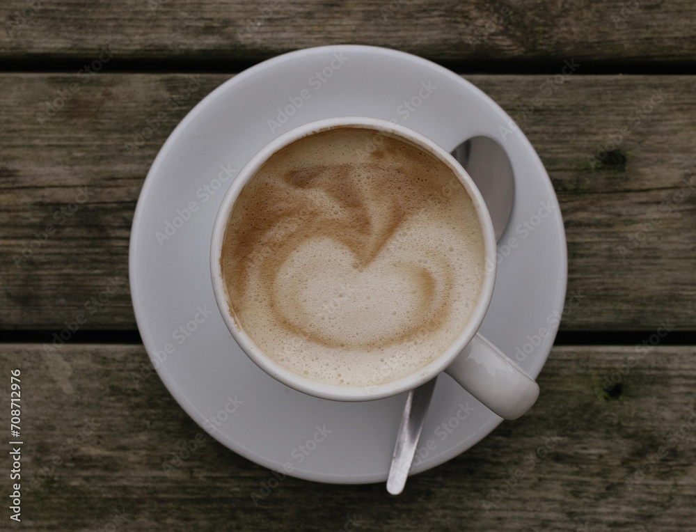 cup of coffee on wooden table cup of coffee on wooden table