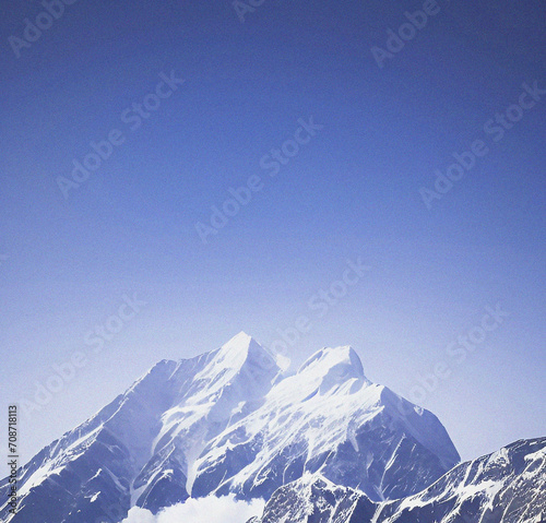 Snow covered mountains in winter. Beautiful background with empty copy space. Snowy mountain peak. Nature, success, travel, holiday concept