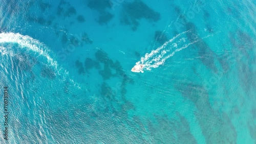 Aerial View of Boat Cruising on Crystal Blue Waters, Hawaii photo