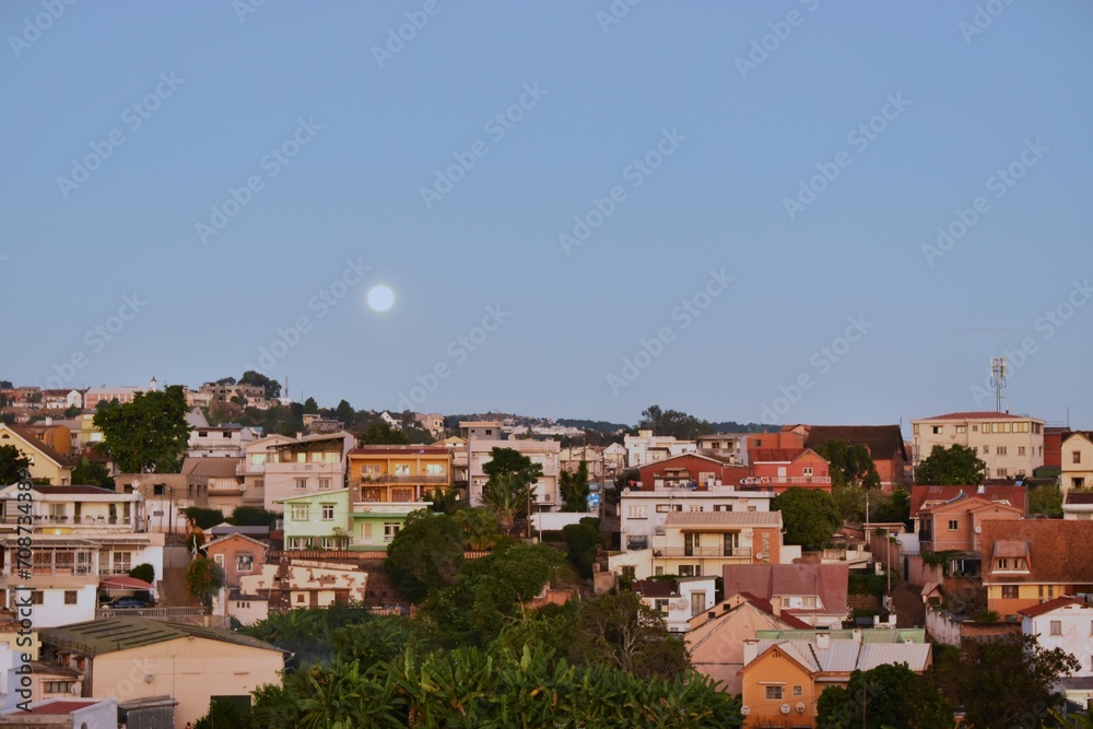 Amazing view of the Analamahisty skyline in the evening with the moon in the sky.  Anamalahitsy, Madagascar