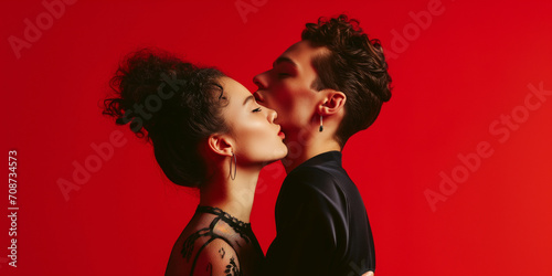 Attractive passionate couple against red background