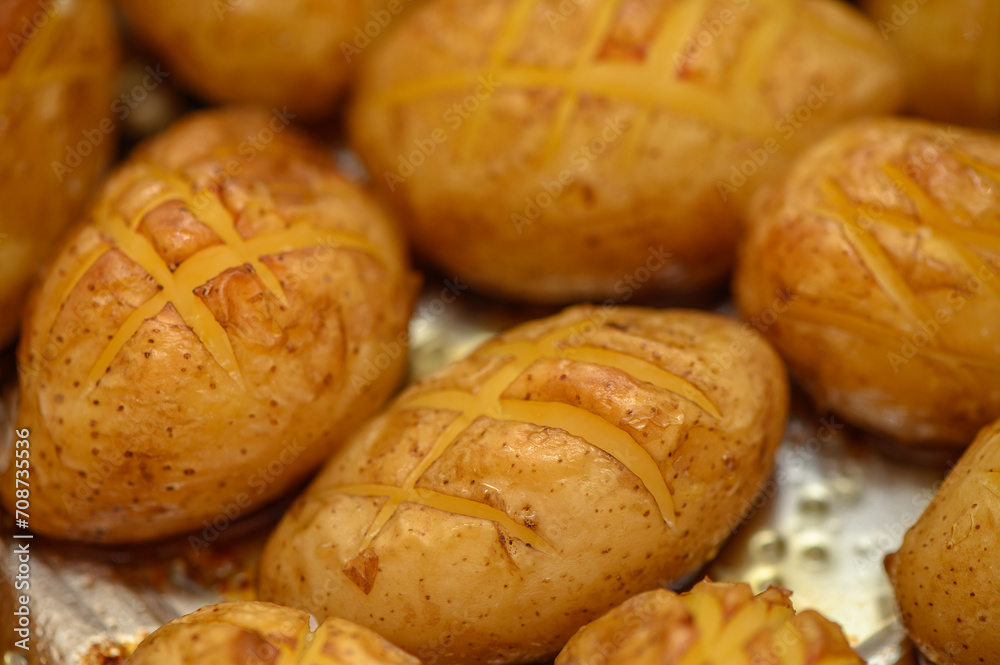 Fototapeta premium delicious baked potatoes in the kitchen 8