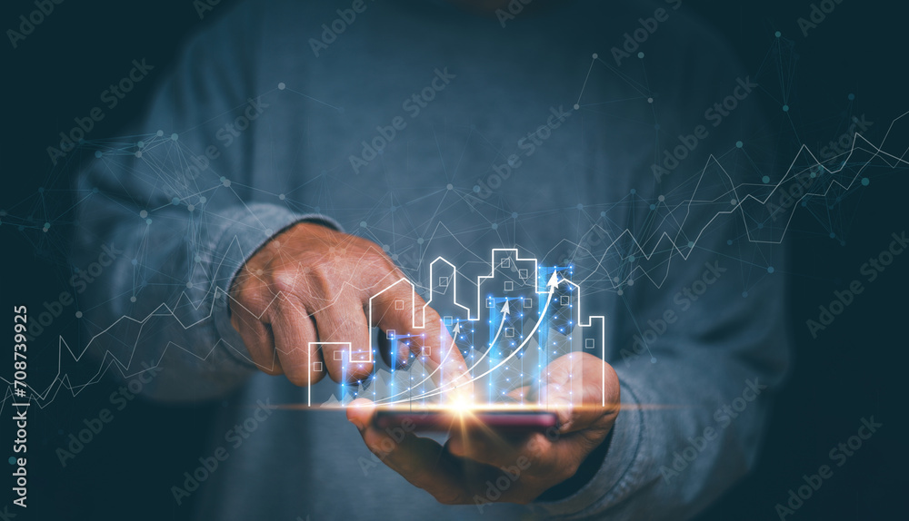 Businessman holding mobile phone with graph of asset business growth, Concept of business prosperity and asset management, Real estate investment marketing analysis, Planning to increase profits. - obrazy, fototapety, plakaty 