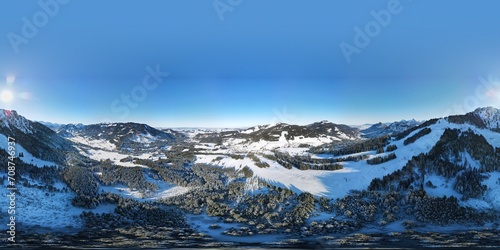 Aerial view on the mountain with the ski lifts on a beautiful winter sunny day. Jungholz, Tirol, Austria.