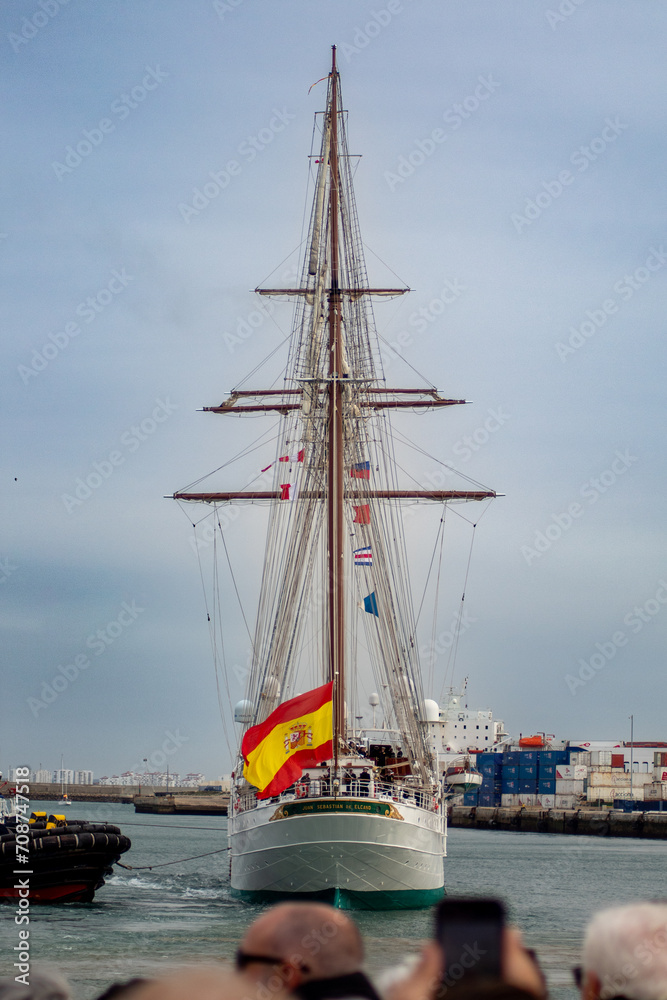 Juan Sebastian de Elcano sailing ship undocking from Cadiz harbor Juan Sebastian de Elcano sailing ship undocking from Cadiz harbor