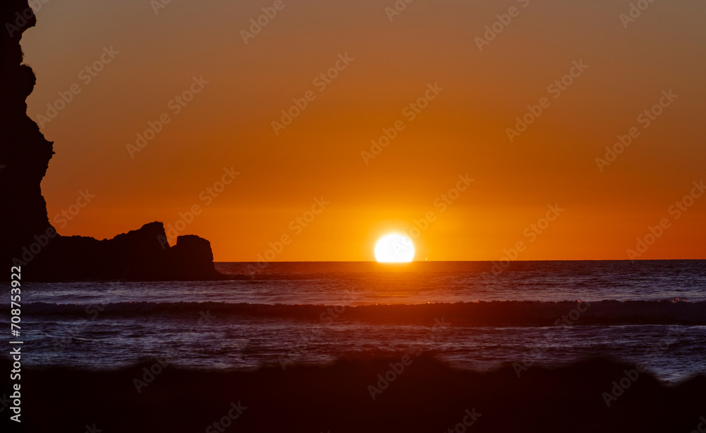 Sunset at Piha, West Auckland, Auckland region of New Zealand. January 12, 2024 - 9