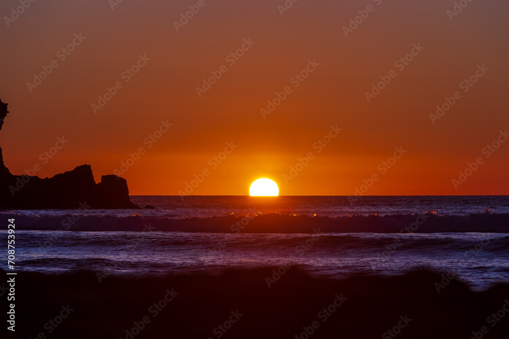 Sunset at Piha, West Auckland, Auckland region of New Zealand. January 12, 2024 - 10