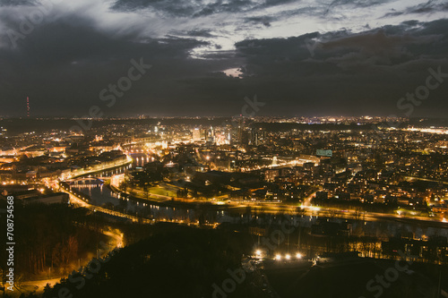 Scenic aerial view of Vilnius Old Town and Neris river at nightfall. Night view of Vilnius, Lithuania.