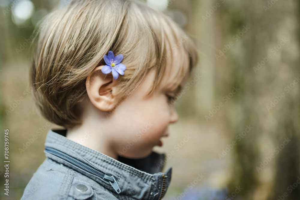 Adorable toddler boy having fun during a hike in the woods on beautiful sunny spring day. Active family leisure with kids. Adorable toddler boy having fun during a hike in the woods on beautiful sunny spring day. Active family leisure with kids.