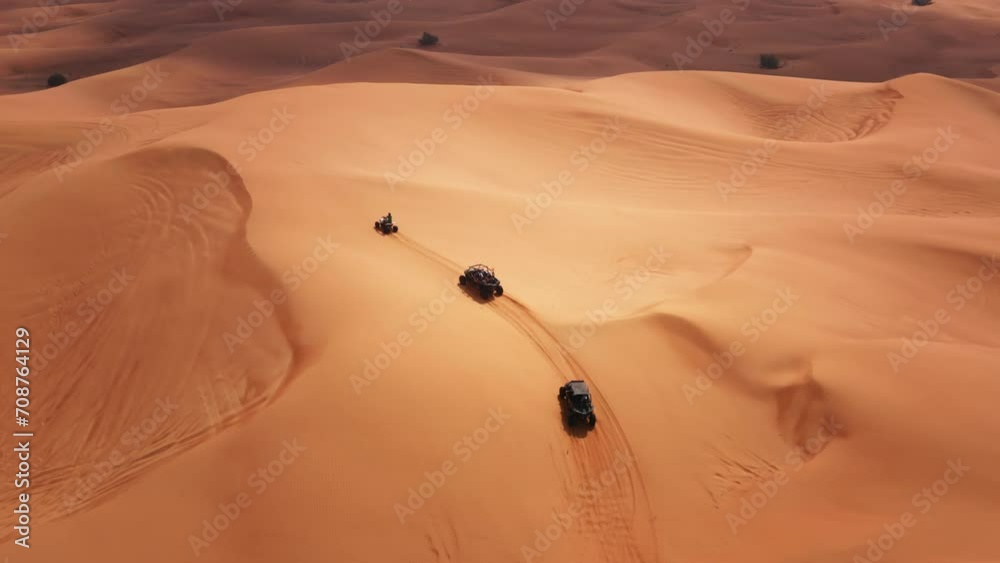 Dune buggy tour in Dubai desert dunes UAE aerial drone view