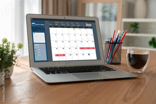 Calendar on computer software application for modish schedule planning for personal organizer and online business photo