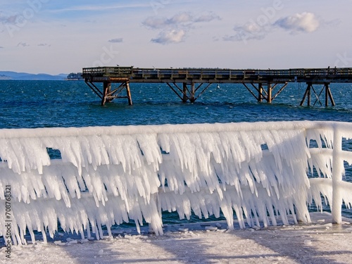 Ice covers rails of a pier in Sidney BC during unusual cold snap photo
