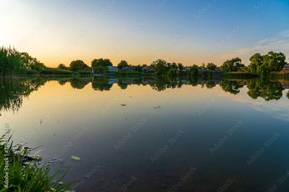 Lake in the village. Background with selective focus and copy space