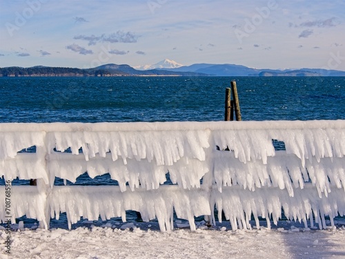Ice covers rails of a pier in Sidney BC during unusual cold snap © pr2is