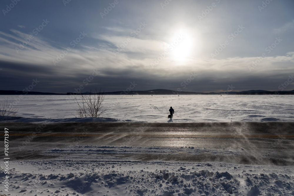 Person walking on a frozen lake