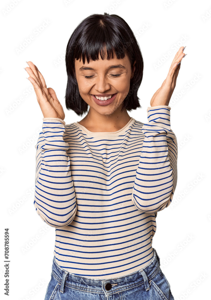 Young Hispanic woman with short black hair in studio joyful laughing a lot. Happiness concept. Young Hispanic woman with short black hair in studio joyful laughing a lot. Happiness concept.