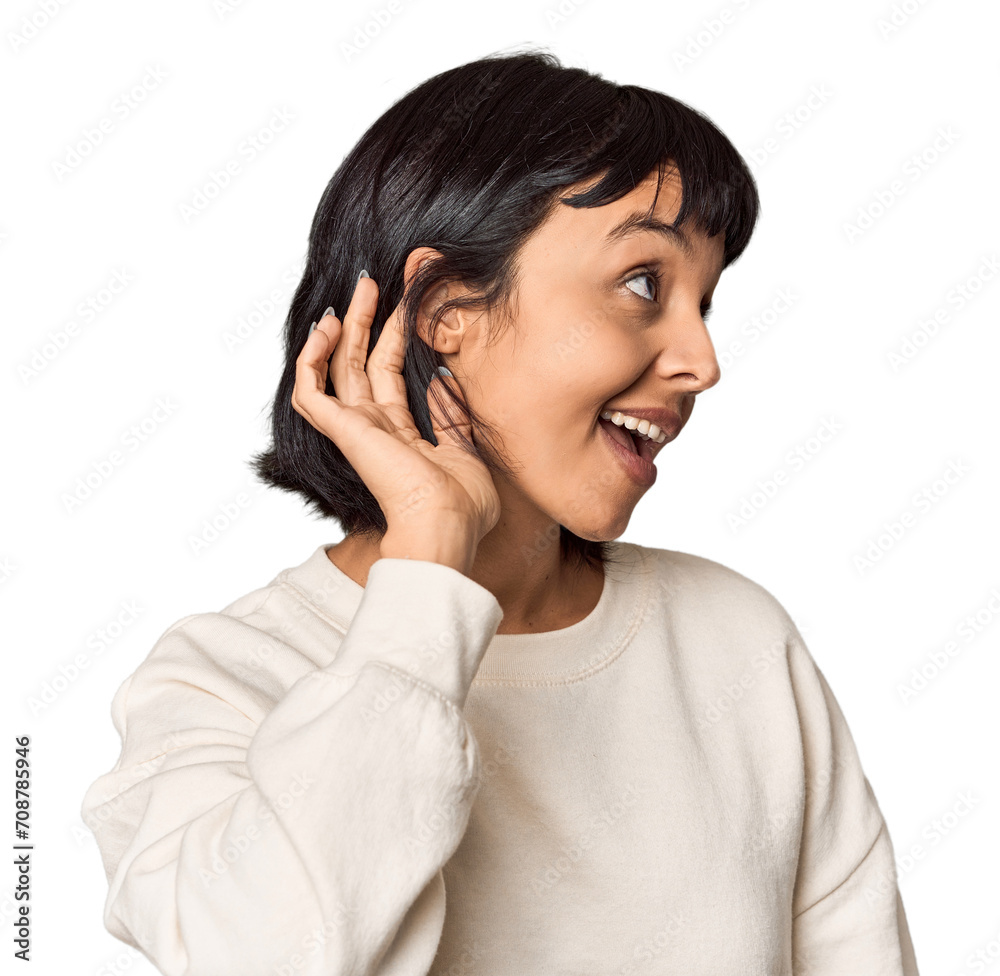 Young Hispanic woman with short black hair in studio trying to listening a gossip. Young Hispanic woman with short black hair in studio trying to listening a gossip.
