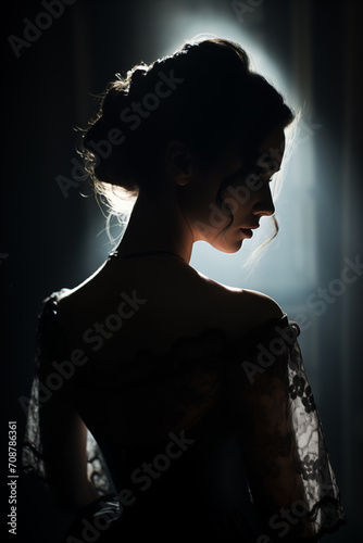 Silhouette of a Woman in Elegant Attire Backlit