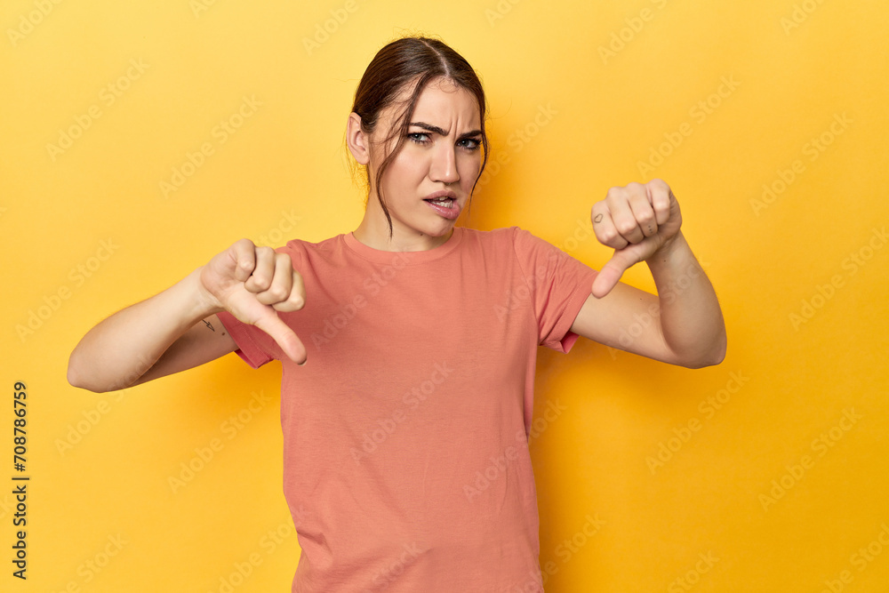 showing thumb down and expressing dislike. showing thumb down and expressing dislike.