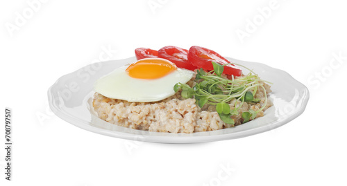 Delicious boiled oatmeal with fried egg, tomato and microgreens isolated on white