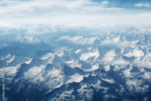 Majestic Journey: Aerial View of Snow-Capped Mountains, White Peaks, and Billowing Clouds in Chile's Andes Landscape
