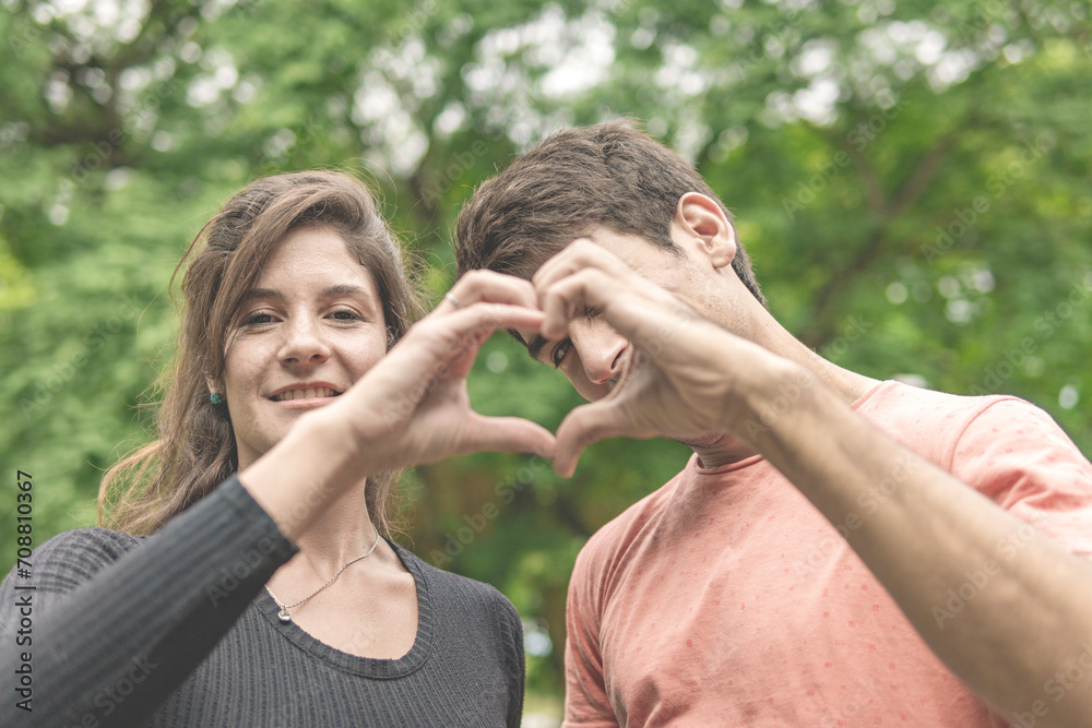 Fototapeta premium Couple holding hands making a heart