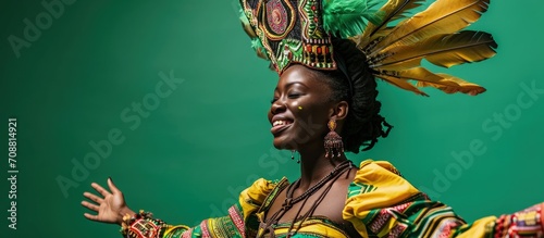 Brazilian black woman in carnival costume on green background with copy space