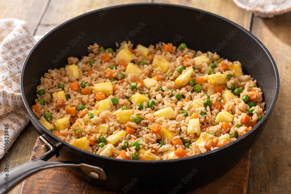 Pineapple fried rice with eggs, carrots and peas