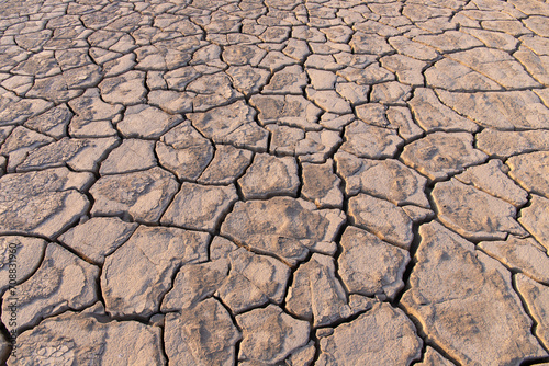 Volcanic cracks in the clay on the ground.