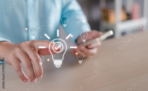 Business solution idea concept. Businessman  creative light bulbs with marketing network, planning strategy, analysis solution and development, modern business technology, Innovative of new idea. photo