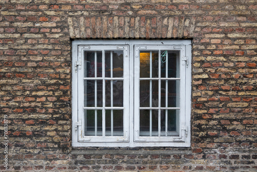 European vintage white old window in the old brick wall exterior background