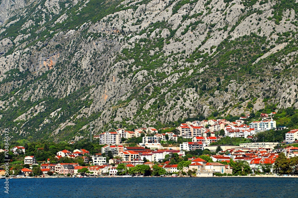 Resort seaside village at the edge of the sea and the foot of the mountains, Bay of Kotor, Adriatic Sea