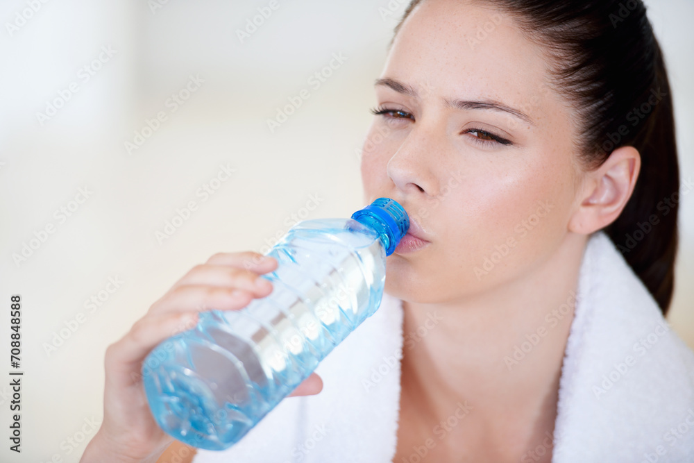 Tired, thinking or woman drinking water on break after exercise, workout or fitness training in gym. Fatigue, healthy or thirsty sports athlete with liquid bottle for wellness, rest or hydration Tired, thinking or woman drinking water on break after exercise, workout or fitness training in gym. Fatigue, healthy or thirsty sports athlete with liquid bottle for wellness, rest or hydration